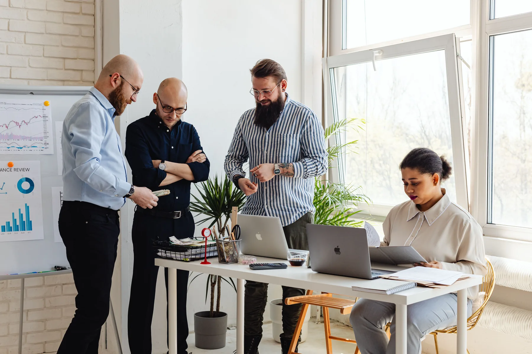 SaaS team reviewing cohort retention and revenue metrics